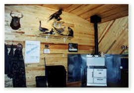 An old-fashioned cookstove is often used but electric heating and modern camp cooking gear is also available. Click on image for full size view.
